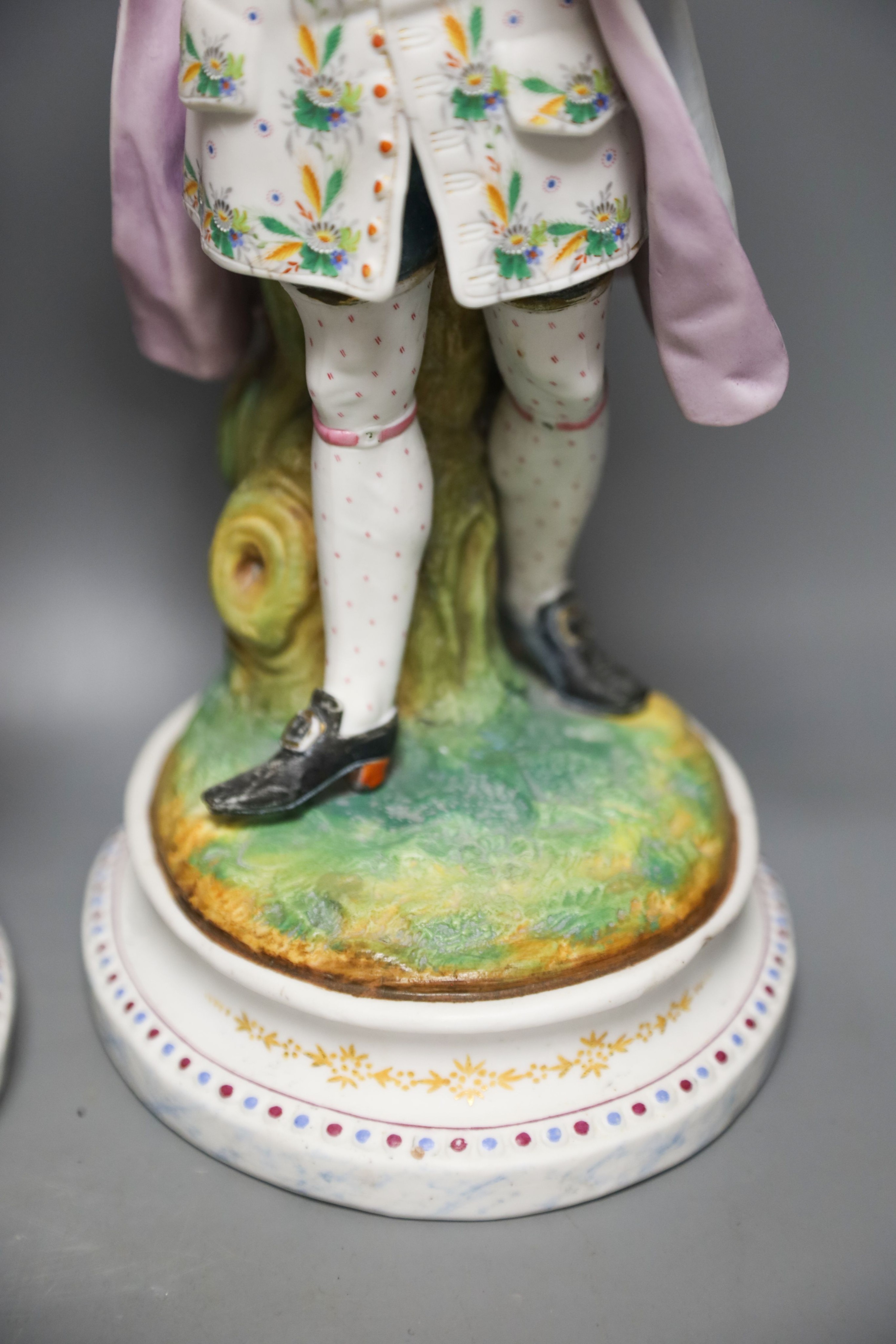 A pair of 19th century French bisque figures of a lady and gentleman 37cm